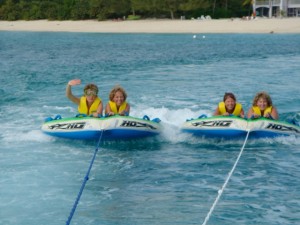 Girls on towable tubes. Girls on towable tubes.
